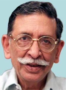 A man with glasses and a mustache.