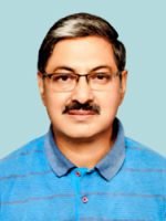 A man wearing glasses and a blue shirt.